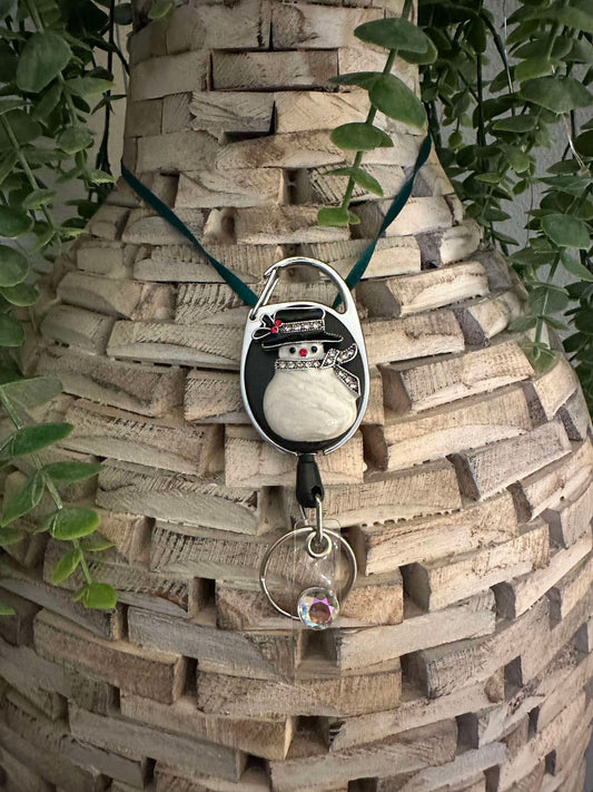 Snowman oval retractable badge reel keychain.